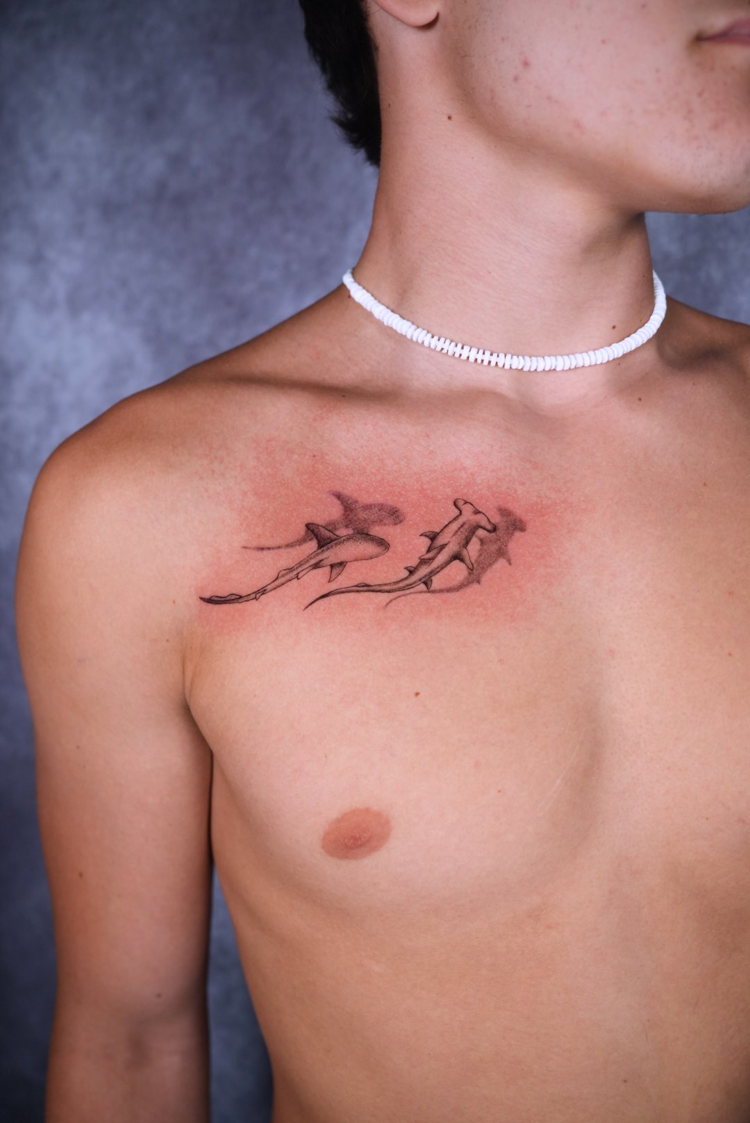 Fine line cherry blossom branch shoulder tattoo by Camila