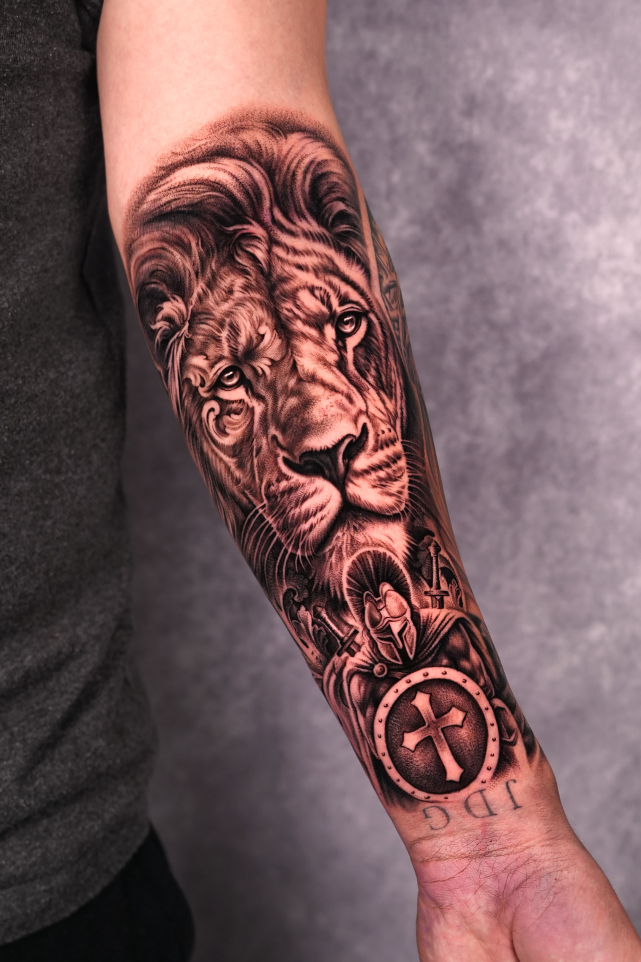 Black and grey tiger and religious symbolism sleeve tattoo by Brayan Batista